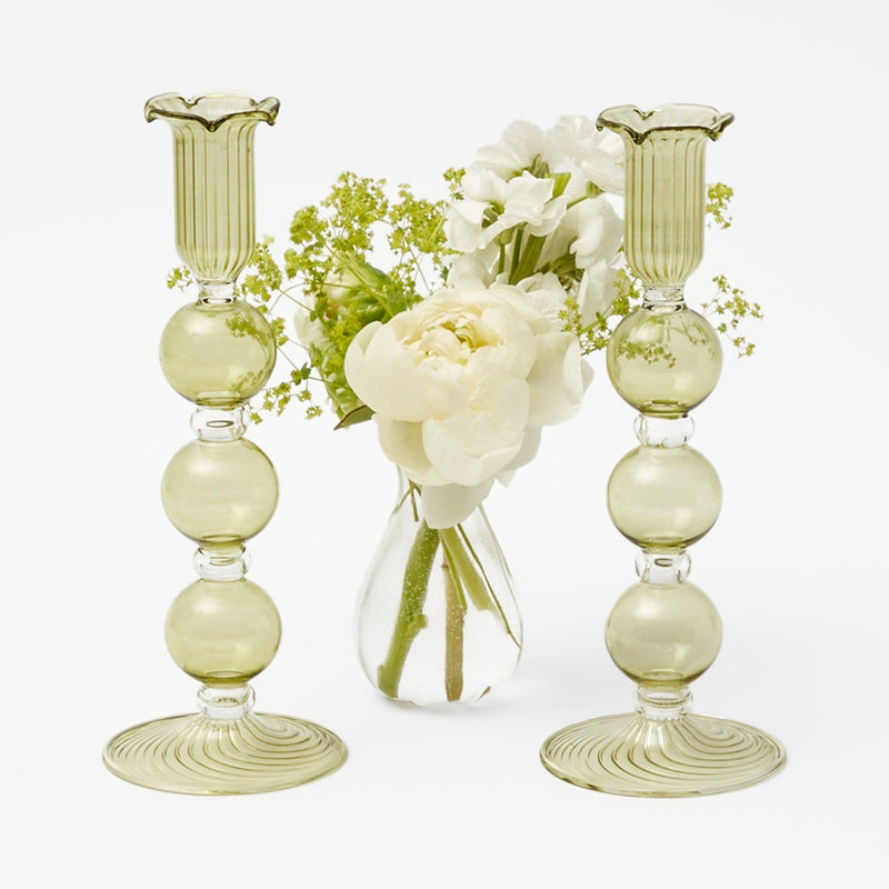 Enhance your home decor with the captivating and inviting presence of the Eden Green Fluted Candle Holders, designed to bring a touch of natural beauty and style to your surroundings.