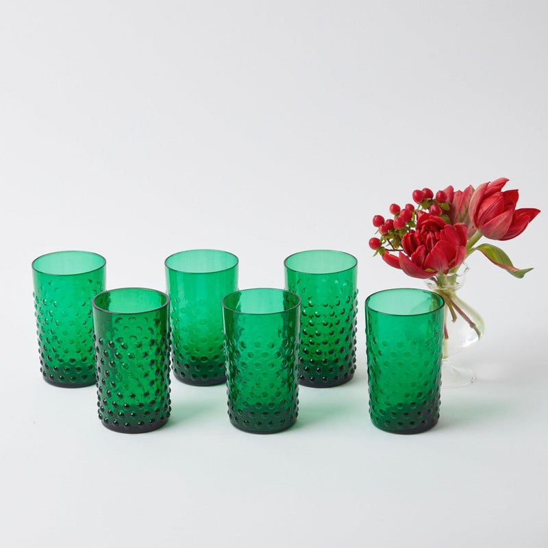 Enhance your holiday gatherings with the festive charm of our Set of 6 Emerald Green Hobnail Glasses, designed to bring a touch of elegance to your Christmas festivities.