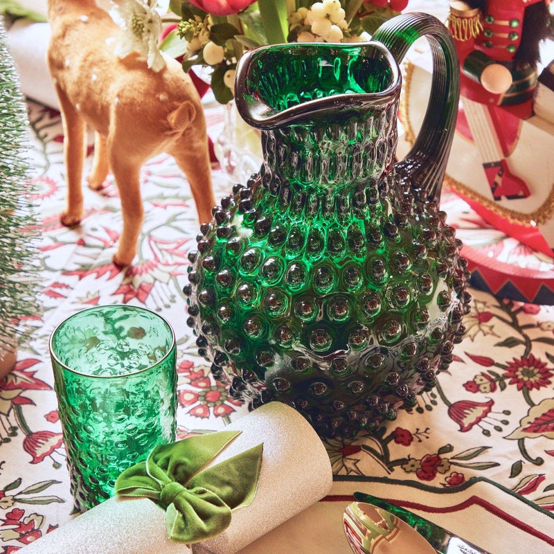 Enhance your holiday celebrations with the festive charm of the Emerald Green Hobnail Jug, designed to bring a touch of elegance to your Christmas festivities, all while serving your favorite holiday drinks.