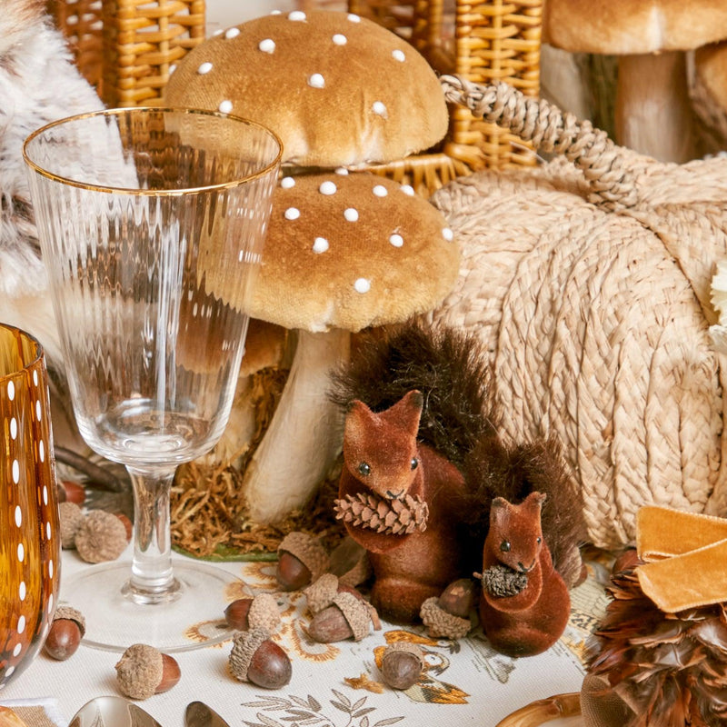 Enchant your space with the sweet presence of Flocked Baby Squirrels (Set of 4).