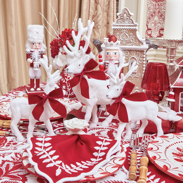 Embrace the magic of the season with the Large White Flocked Reindeer Set, two magnificent reindeer that radiate holiday charm with their velvety bows.