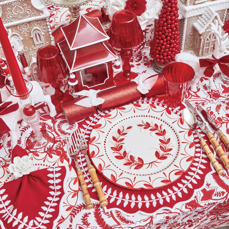 Create a festive ambiance with Red Glitter Crackers and their delightful White Velvet Bows.