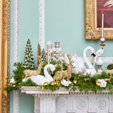 Embrace the serene beauty of winter with the A Winter's Tale Mantlescape, an elegant collection of decorations that transports your guests to a snowy wonderland right at your mantle.