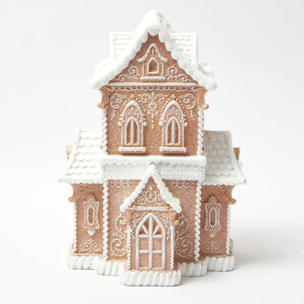 Add a whimsical touch to your holiday decor with the Gingerbread Townhouse (Large), a delightful centerpiece that embodies the magic of a charming gingerbread town.