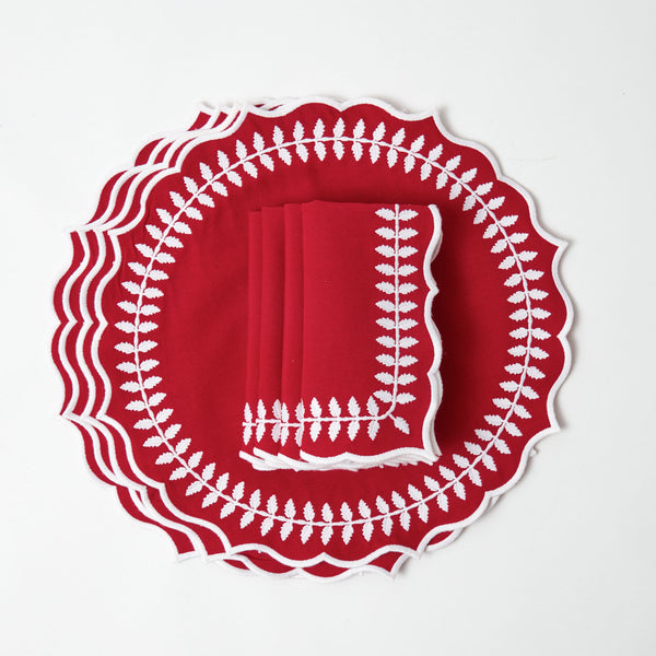 Elevate your dining experience with this coordinated set of red placemats and napkins.