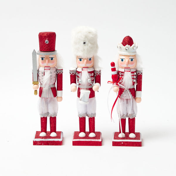 Elevate your holiday decor with the Red Glitter Nutcracker Trio - a dazzling trio of festive charm.