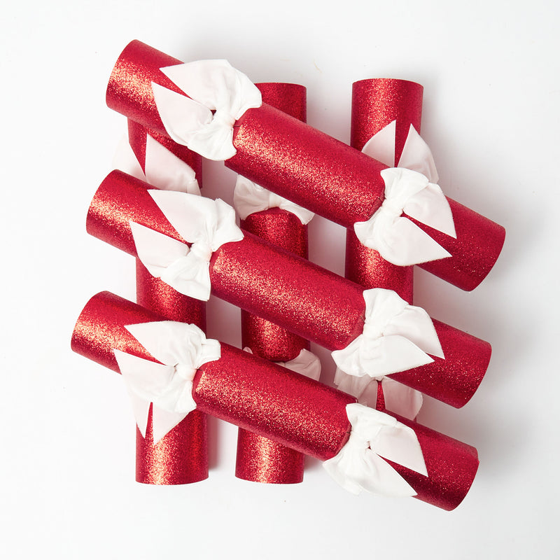 Decorate your table with the shimmering allure of Red Glitter Crackers and White Velvet Bows.