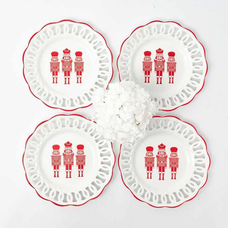 Enhance your holiday table with White Lace Nutcracker Starter Plates (Set of 4).