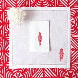 Christmas Table Linens: White Napkins with Red Nutcracker Detail