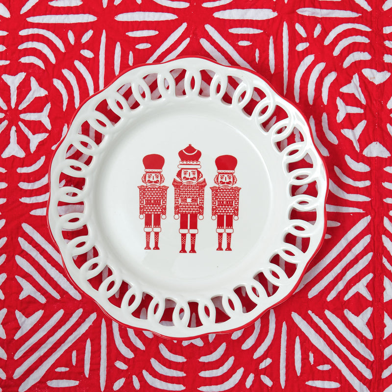 Turn your holiday feasts into a winter wonderland with the White Lace Nutcracker Dinner Plate, an exquisite and festive piece that enhances your celebrations with a touch of seasonal charm.