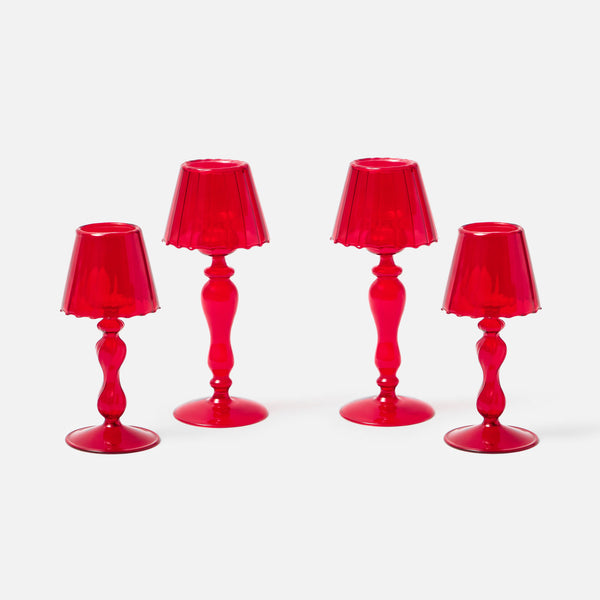 Illuminate your space with a warm and welcoming glow using the Red Glass Lantern Tea Light Holder Set, perfect for creating an inviting atmosphere.