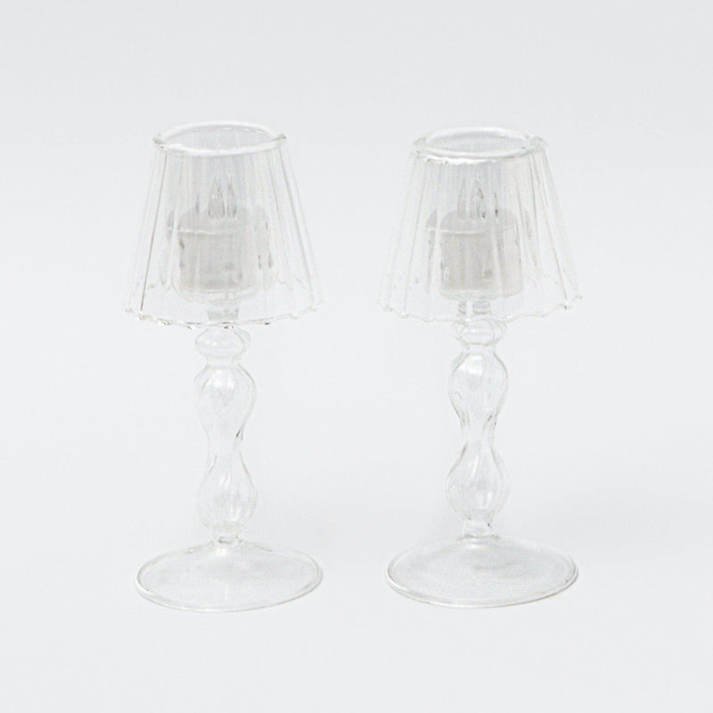 Illuminate your Christmas decor with the Glass Lantern Tea Light Holder Pair - a charming addition to create a warm and inviting holiday atmosphere.