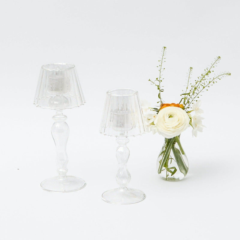 Illuminate your surroundings with the whimsical and enchanting Glass Lantern Tea Light Holders, designed to create an atmosphere of captivating illumination and style.