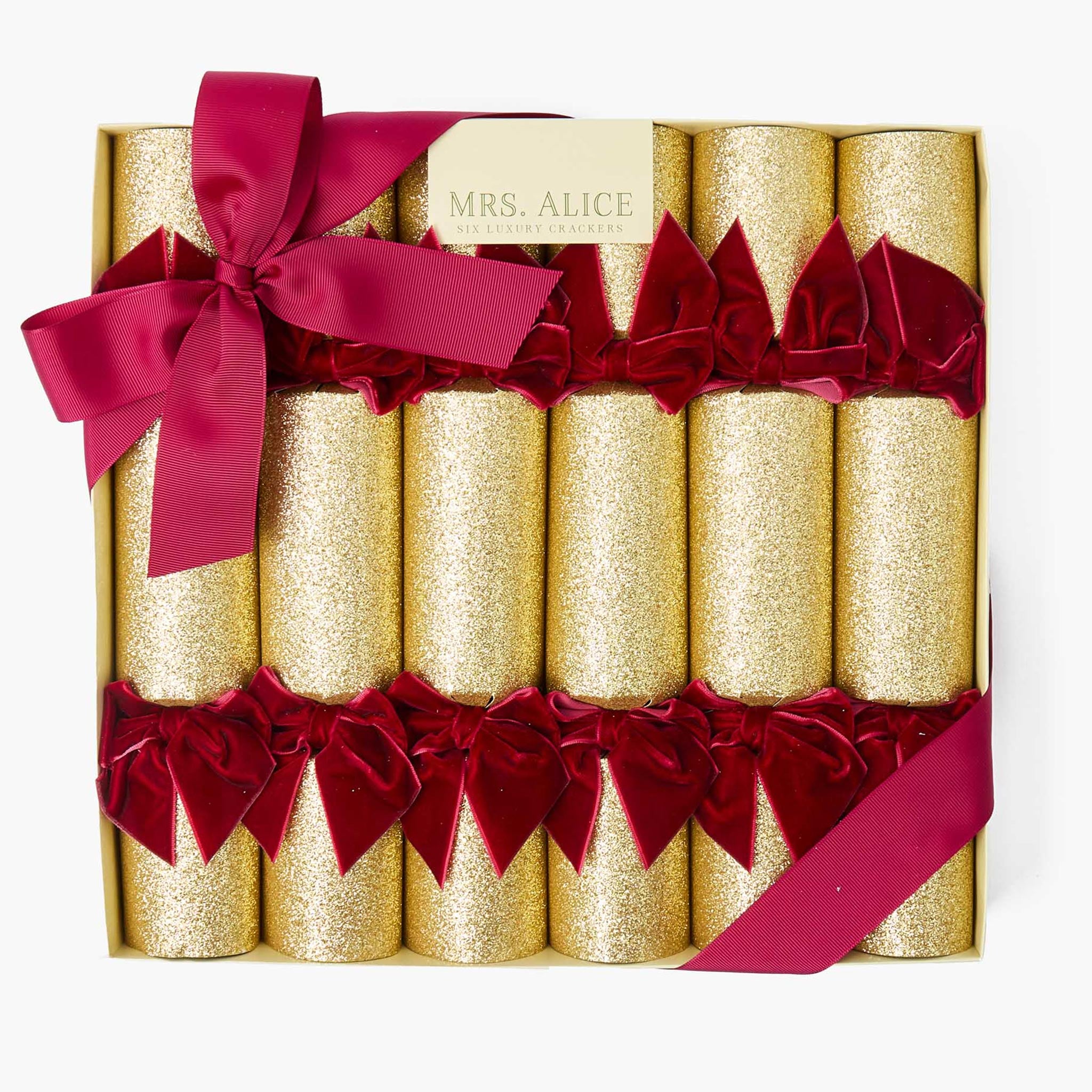 Set of gold crackers with red ribbons in a decorative box, branded 'Mrs. Alice'.