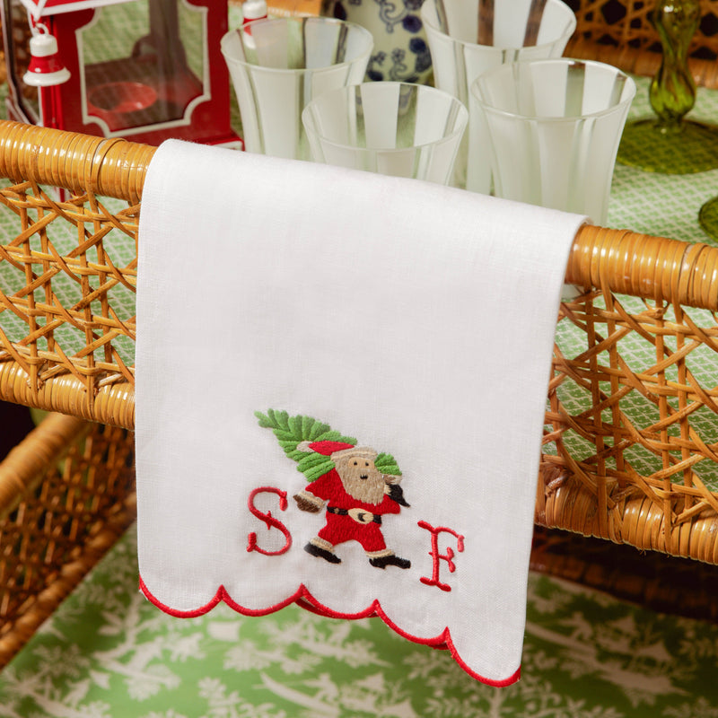 Enhance your Christmas decor with the playful and delightful Embroidered Father Christmas Linen Hand Towel, designed to bring a touch of tradition and whimsy to your holiday festivities.