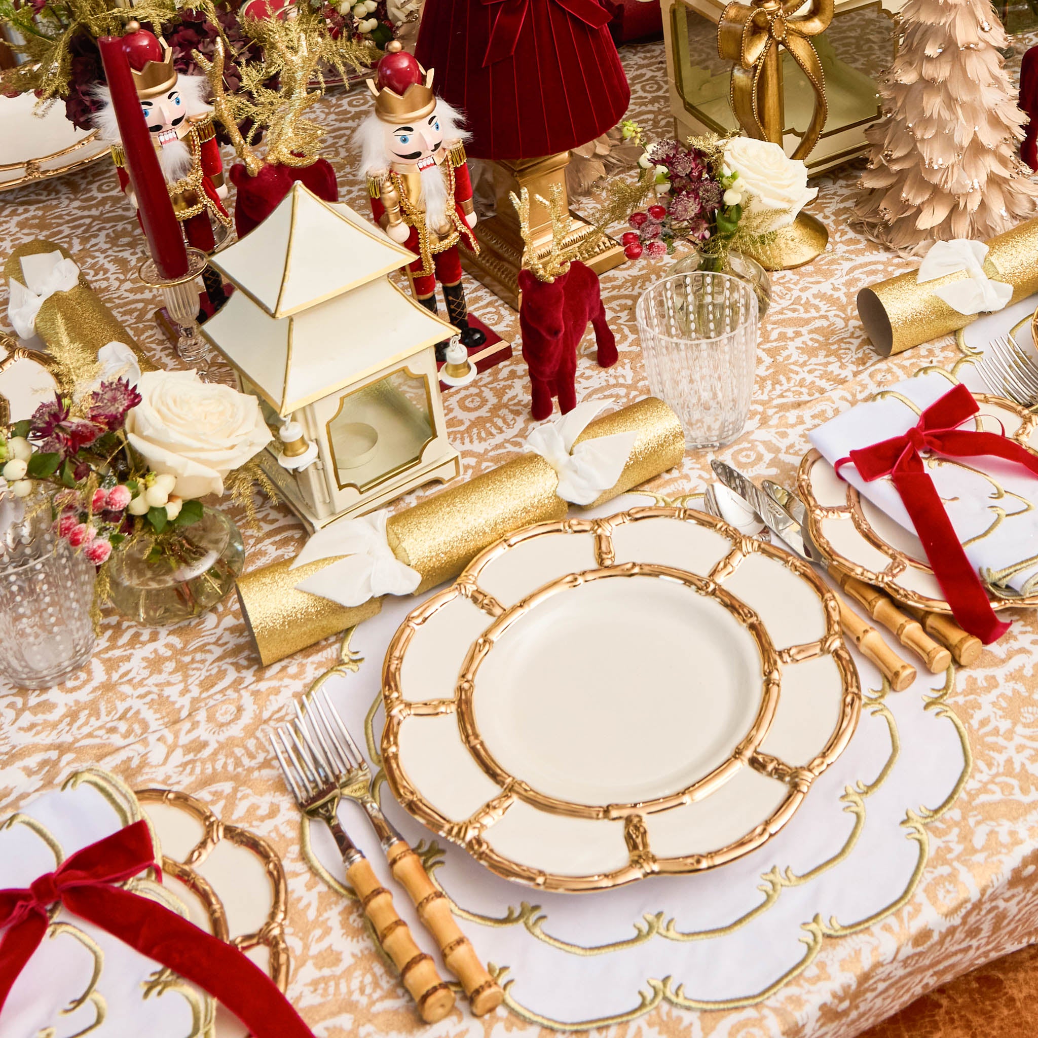 Decorative Christmas table setting with gold and red accents