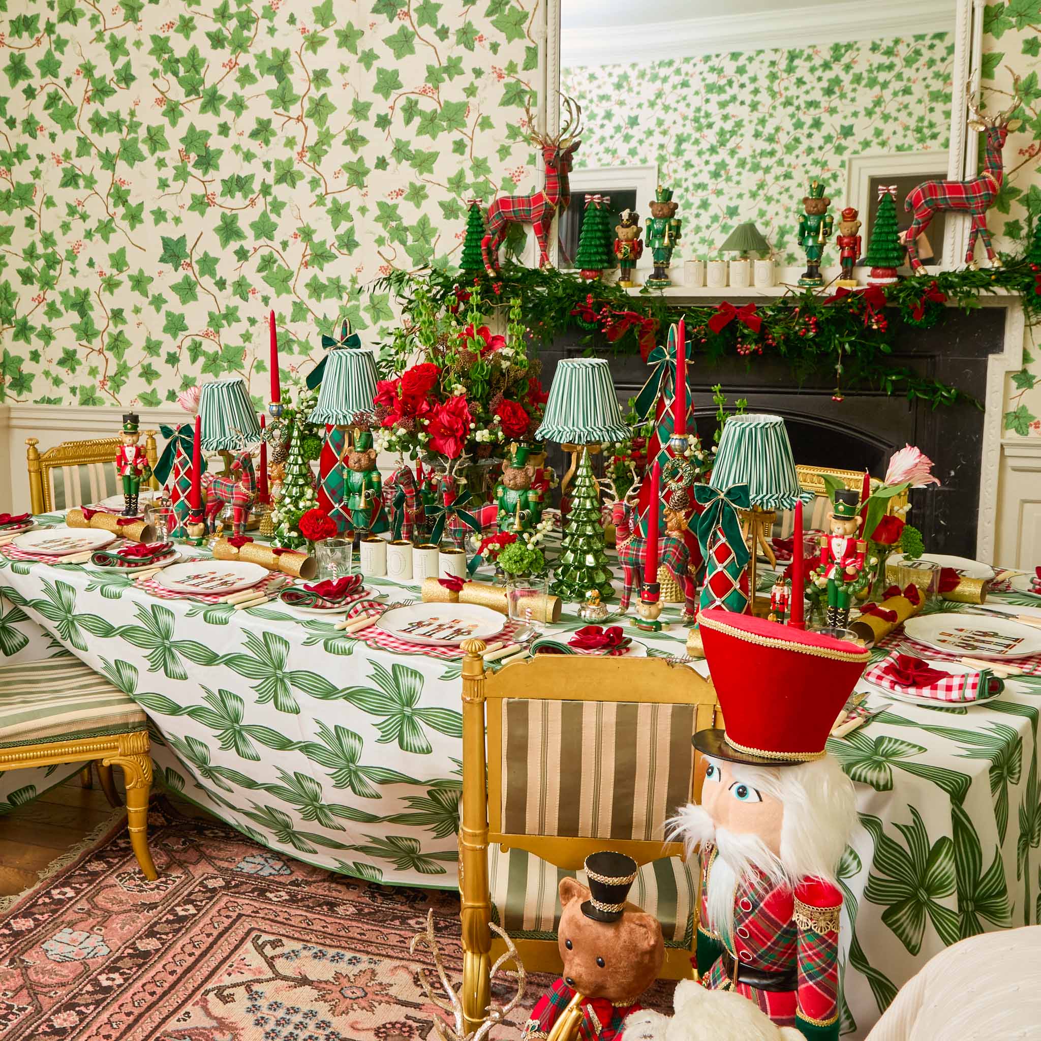 Decorative Christmas table setting with a fireplace and festive decorations.