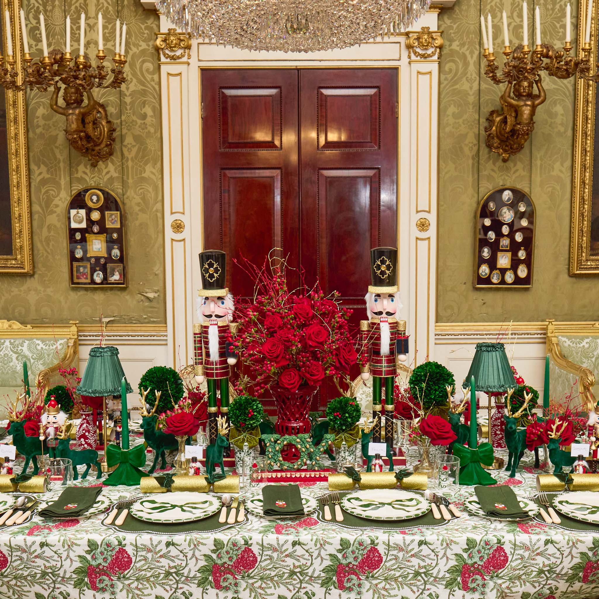 Decorative table setting with nutcrackers and floral arrangement in an elegant room.