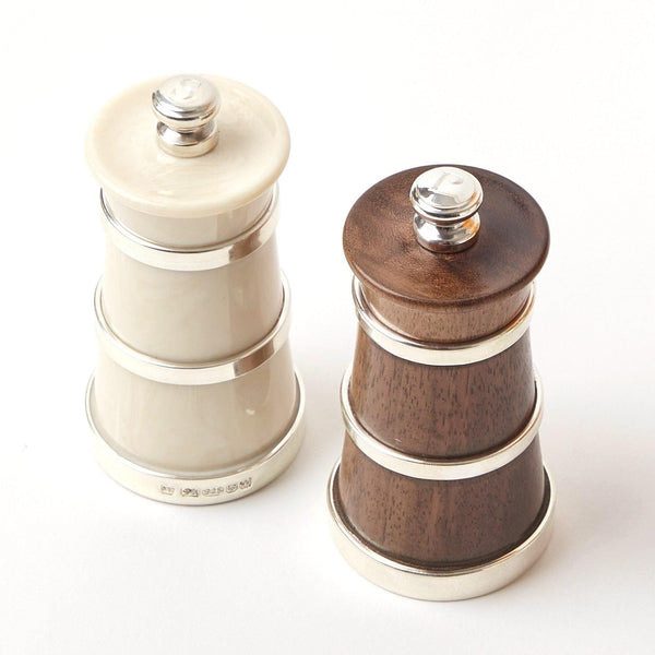 Elevate your dining experience with our Ivory & Rosewood Salt & Pepper Set - a touch of classic elegance for your table.