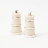 Ivory salt and pepper shakers, designed as a matching pair.