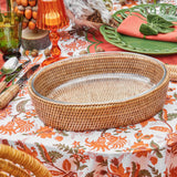 Woven rattan basket ideal for presenting and carrying casseroles.