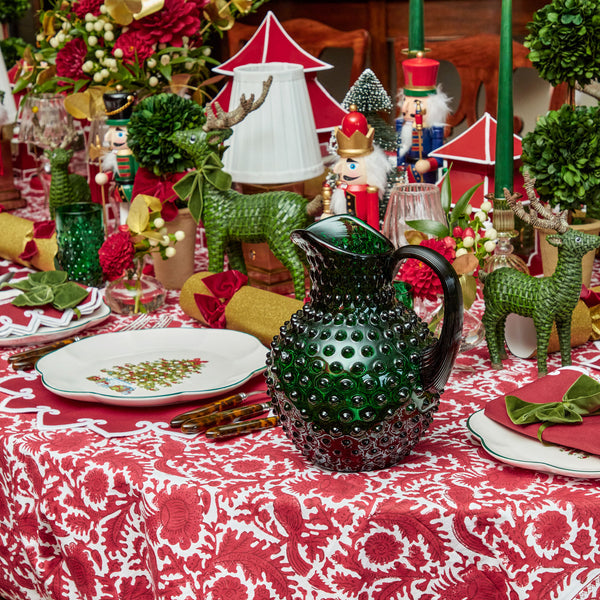 Add a touch of festive elegance to your holiday decor with the Emerald Green Hobnail Glasses & Jug Set, perfect for creating a sophisticated and inviting atmosphere.