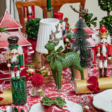 Graceful forest green reindeer figurines for your festive setup.