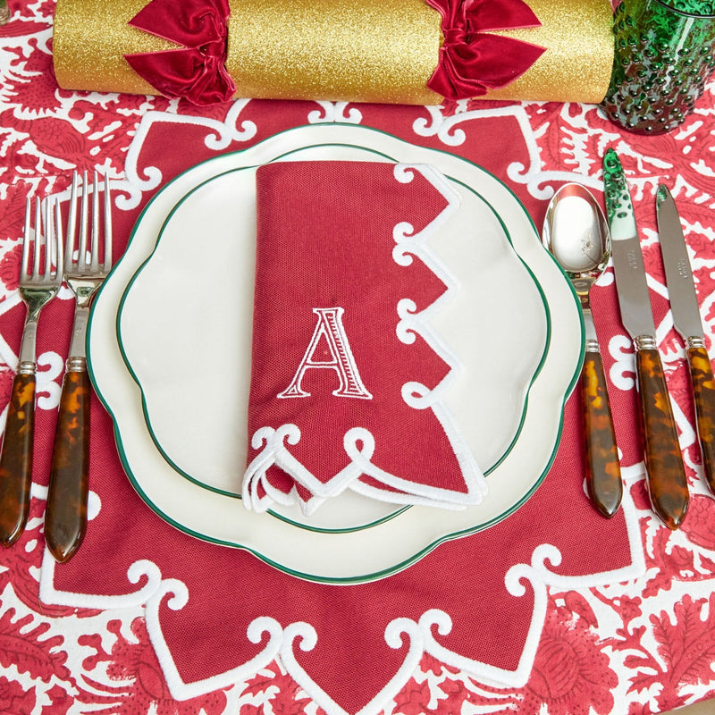 Bring the holiday spirit to your table with Angelina Red Berry Placemats & Napkins.