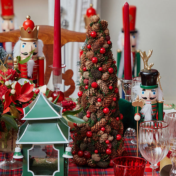 Elevate your holiday decorations with the Pinecone and Berry Tree, a delightful and festive tree that adds a touch of natural charm and holiday spirit to your space.
