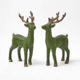 Two elegant forest green rattan reindeer statues.