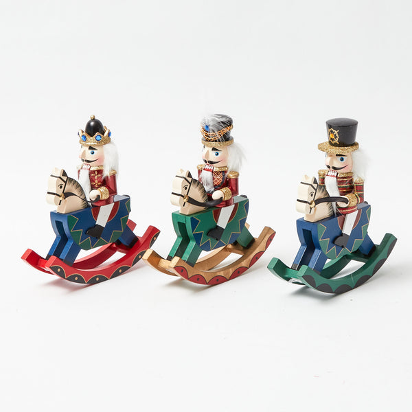 Capture the holiday spirit with the Rocking Horse Nutcracker Trio, a whimsical trio of nutcracker figures perched atop rocking horses, adding a playful touch to your seasonal decor.