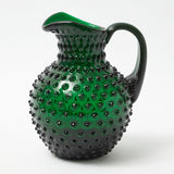 Elevate your Christmas table with our Emerald Green Hobnail Jug - a stunning addition to your holiday gatherings, perfect for serving your favorite holiday drinks.