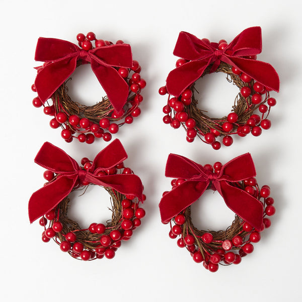 Elevate your holiday decor with the Red Berry Wreaths Set, featuring four charming wreaths adorned with vibrant red berries, adding a pop of festive color to your home.