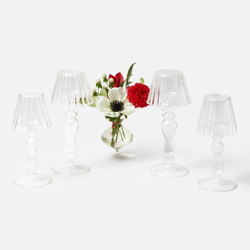 Turn your living space into a chic haven with the Glass Lantern Tea Light Holder Set, a must-have for adding a touch of timeless elegance and enchanting illumination to your home.