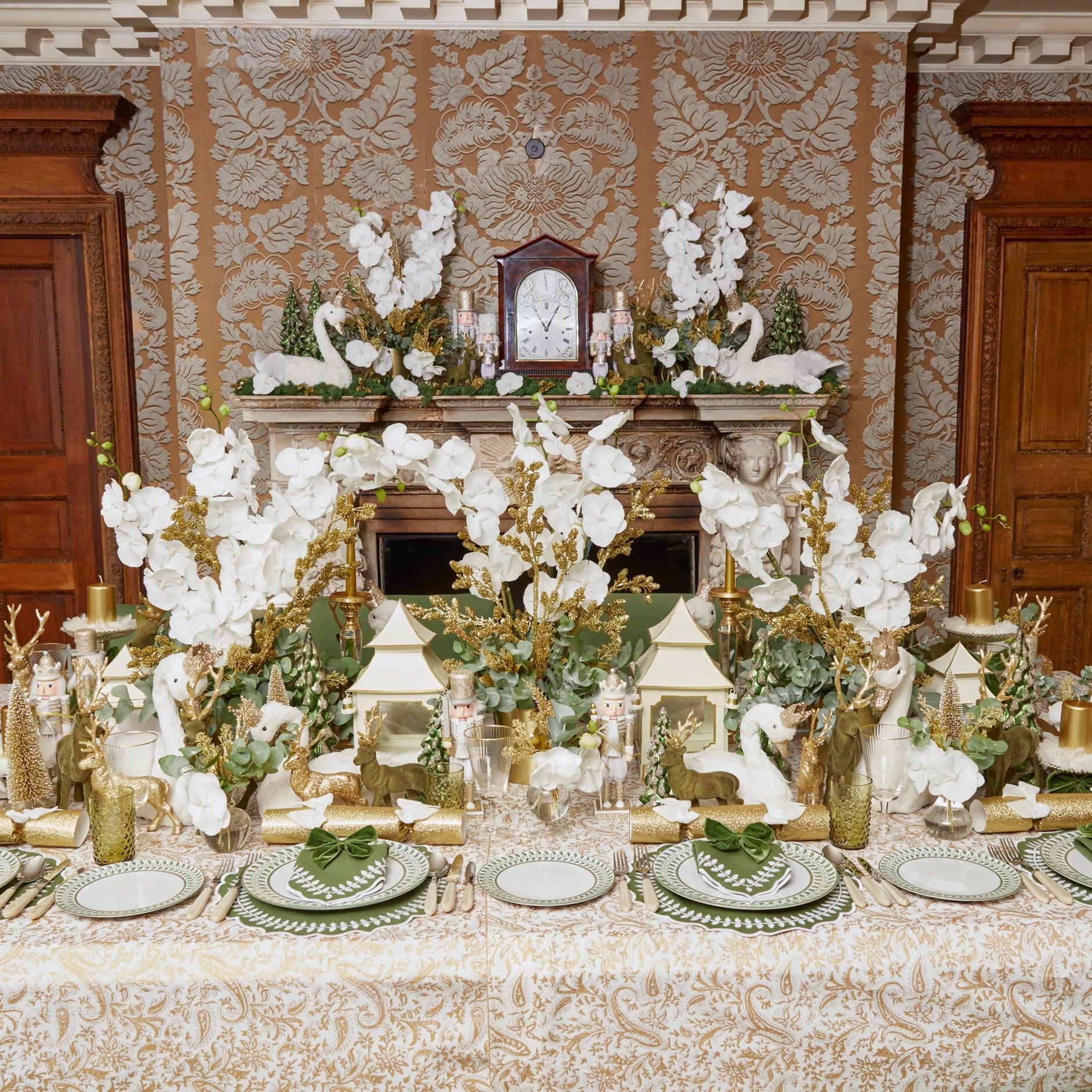 Make each holiday meal a celebration of woodland charm with the Large Olive Green Flocked Reindeer Pair, a perfect duo to create a cozy and inviting Christmas atmosphere.