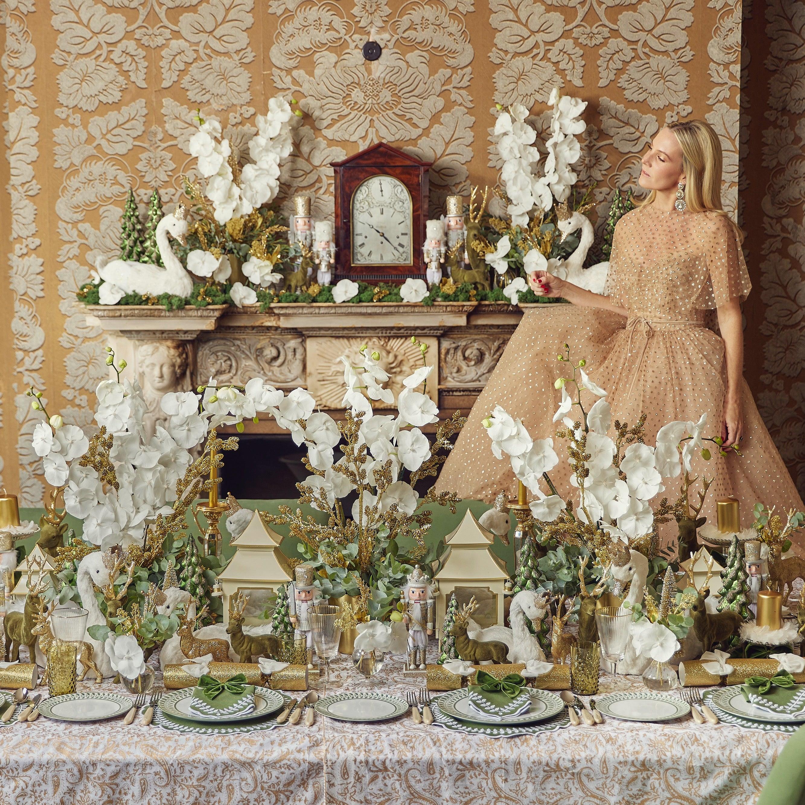 Enhance your holiday gatherings with the playful charm of the Large Olive Green Flocked Reindeer Pair, designed to bring a touch of tradition and whimsy to your Christmas celebrations in a woodsy style.