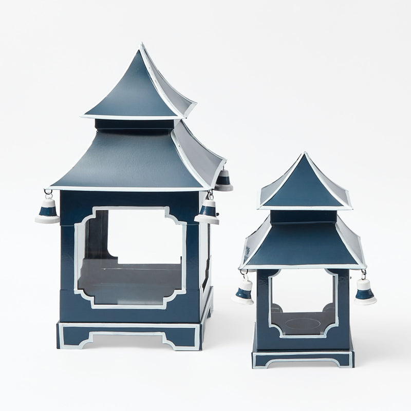 Lantern designed with a pagoda-inspired silhouette in midnight blue.