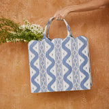 Elevate your wardrobe with the captivating Mrs. Alice Tote Bag in Blue Ikat, designed to bring a touch of sophistication and a pop of pattern to your daily ensembles.