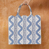Enhance your style with the warmth and inviting presence of the Mrs. Alice Tote Bag in Blue Ikat, designed to bring a touch of traditional beauty and a pop of pattern to your ensembles.