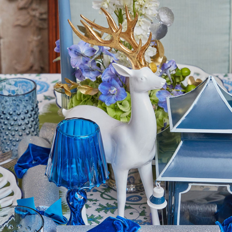 Welcome the season with grace and elegance using these White Reindeer with Gold Antlers.