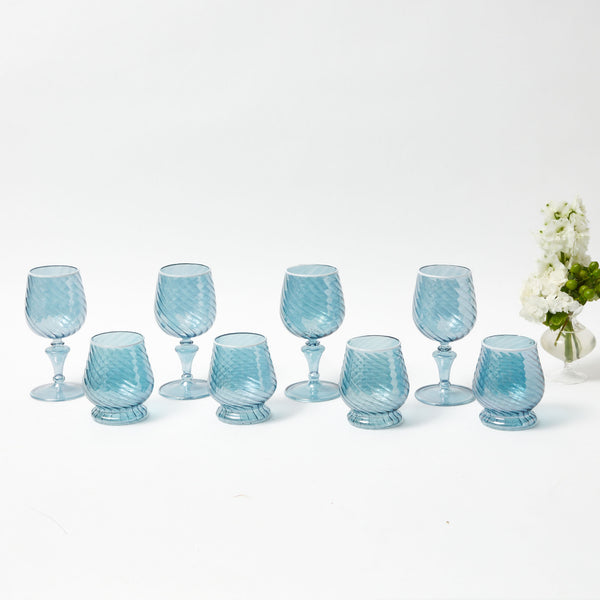 Elevate your dining experience with the Camille Blue Glassware Set, a collection of 17 pieces that infuse your table setting with timeless elegance and a charming blue tint.