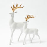Enhance your holiday decor with the charm of these Large White Reindeer figurines and their Gold Antlers.