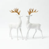 Elevate your holiday decor with the beauty of these White Reindeer and their Gold Antlers.
