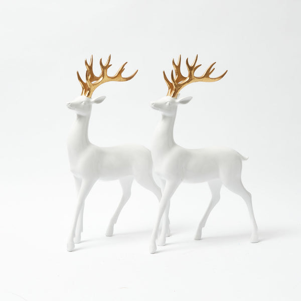 Decorate your space with these elegant White Reindeer figurines featuring Gold Antlers.