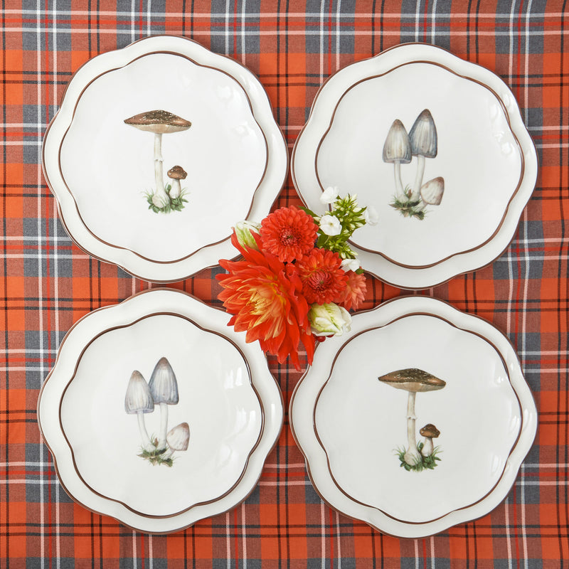 Scalloped mushroom dinner and starter plates, a set of 16 for a stylish table arrangement.