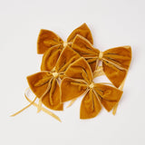 Elevate your table setting with the luxurious Mustard Velvet Napkin Bows in a set of 4.