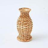 Bring rustic warmth with the Set of 3 Natural Rattan Vases.