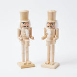 Add a touch of rustic charm to your Christmas decor with the Natural Wood Nutcracker Pair - a delightful addition to create a warm and cozy holiday atmosphere.