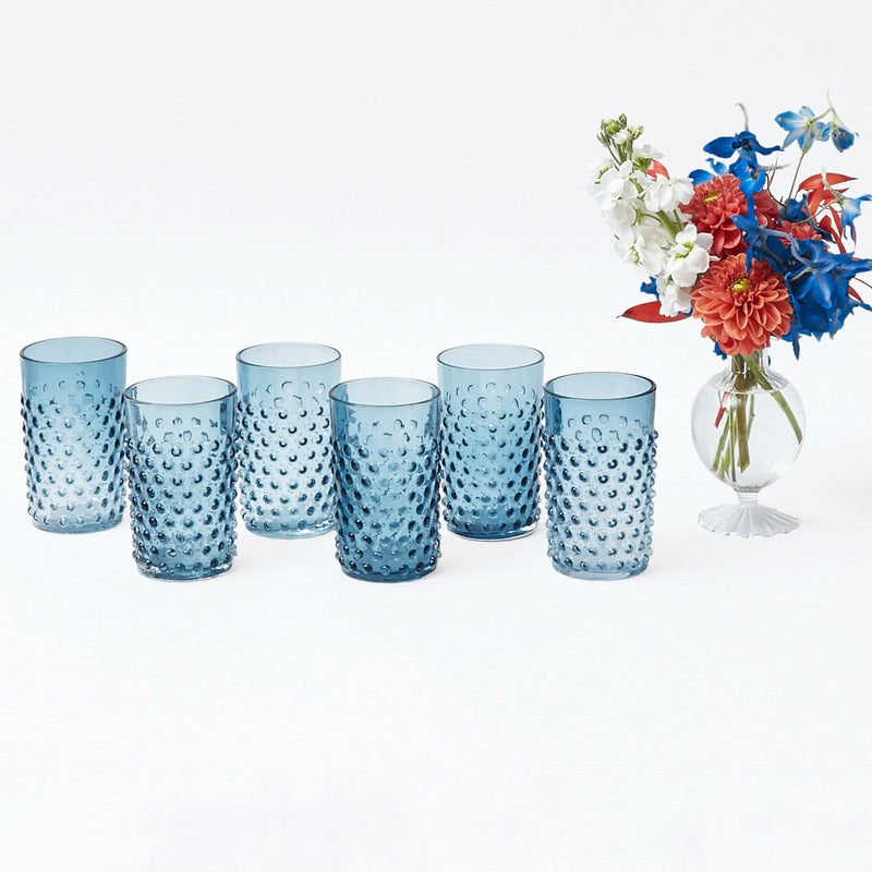 Enhance your dinner parties with the classic charm of our Set of 6 Hobnail Navy Glasses, designed to bring a touch of elegance to your drinking experience.