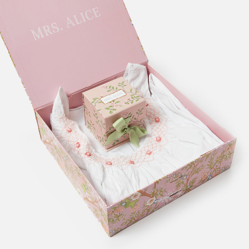 Experience peaceful nights with the Bonne Nuit Pink Giftscape, showcasing a lovely Pink Sleeveless Nightdress, a fragrant Rose Petal Scented Candle, and ten monogrammable Pink Chintz Pochettes.